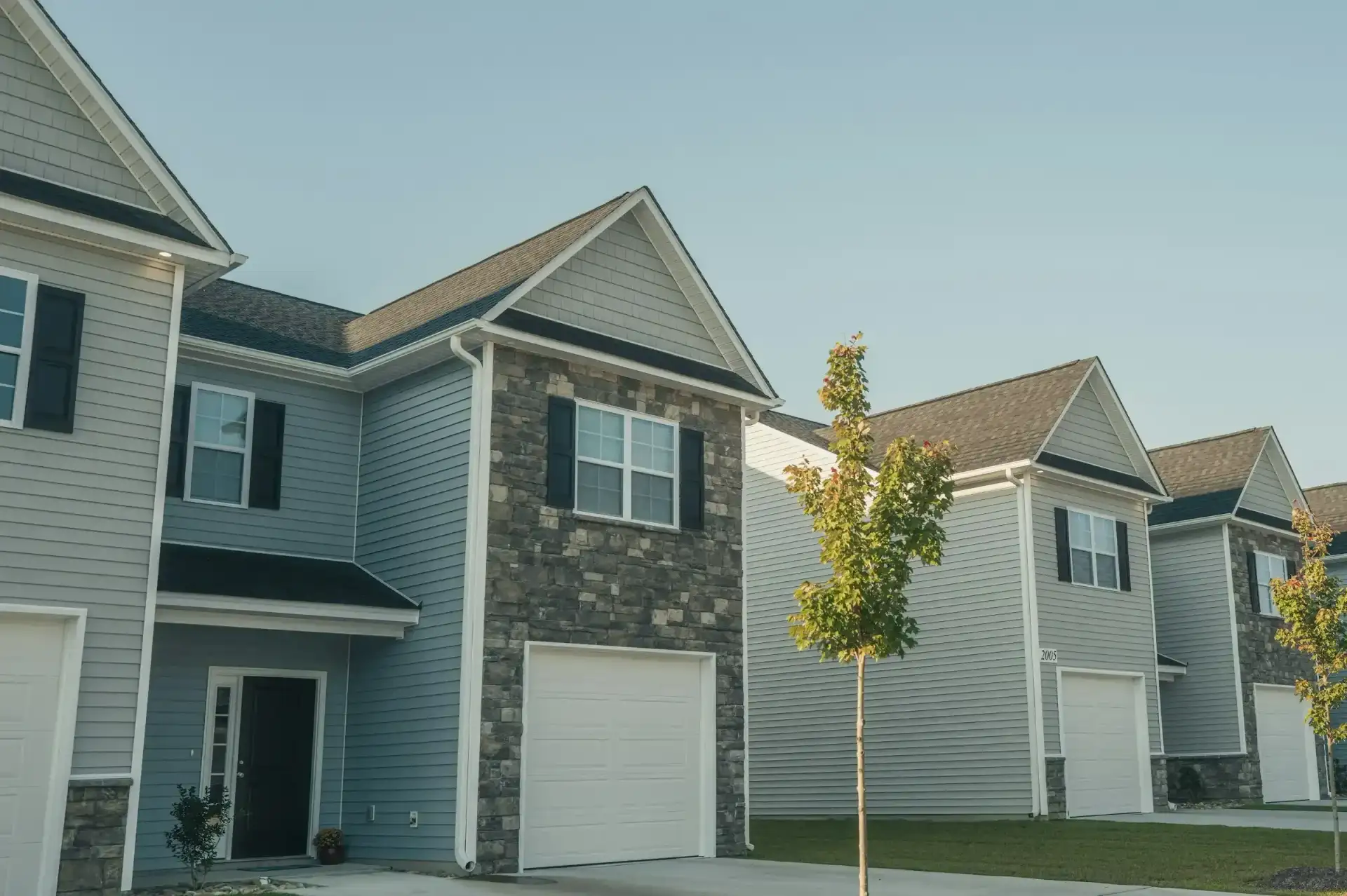 Row of new two-story homes with garages